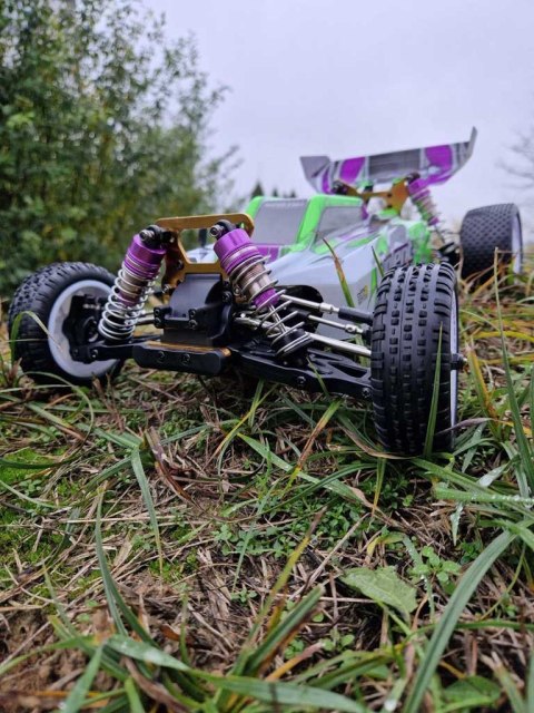 Kik Sp. z o. o. Sp. k. Samochód zdalnie sterowny terenowy wyczynowy WLToys 104002 1:10 4WD 2,4Ghz Kik Sp. z o. o. Sp. k. Samochód zdalnie sterowny terenowy wyczynowy WLToys 104002 1:10 4WD 2,4Ghz